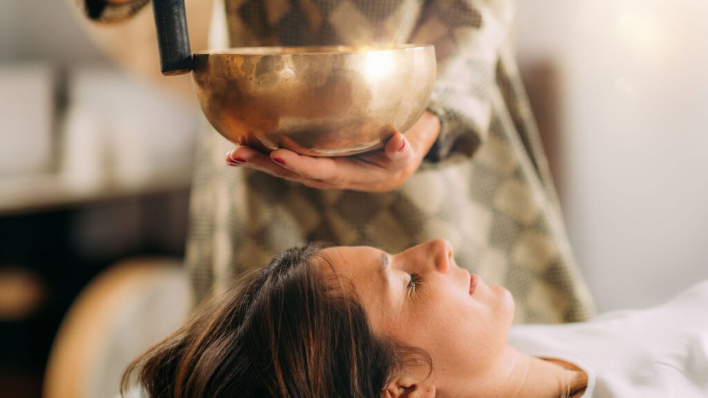sound healing on private client with bronze bowl