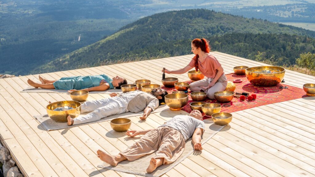 group sound healing outdoors on mountain
